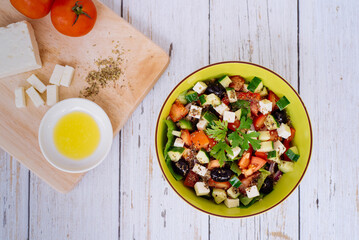 Healthy salad in a bowl on a wooden table