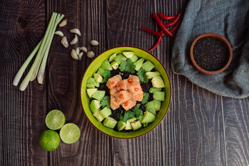 Healthy salad in a bowl on a wooden table