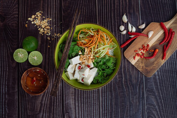 Healthy salad in a bowl on a wooden table