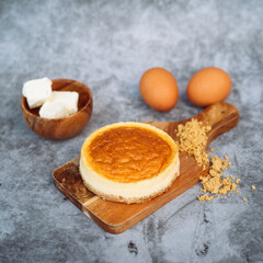 Fluffy Cloud Cheesecake with ingredients on a grey background table