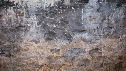 Close-up horizontal photograph of a gray stone textured wall background with copy space.