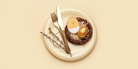 Beautiful table setting with Easter cookie on yellow background