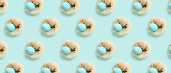 Many nests with Easter eggs on light blue background. Pattern for design