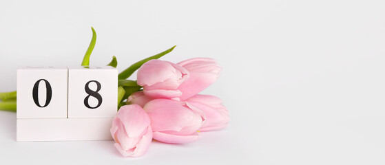Calendar and beautiful tulip flowers on light background. Women's Day celebration