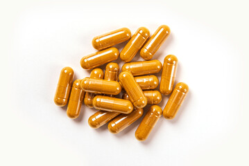 Turmeric capsules isolated on white background. Top view