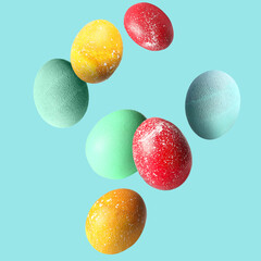 Beautiful flying Easter eggs on light blue background