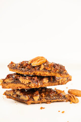Golden crunchy fresh baked pecan diamond cookies made on a rich short dough.