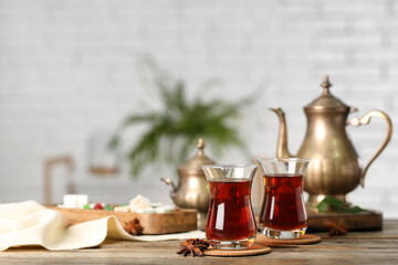Cups of Turkish tea on wooden table