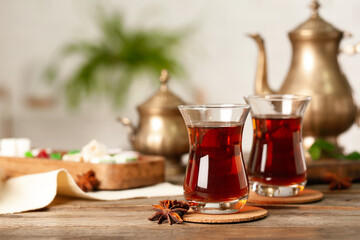Cups of Turkish tea on wooden table