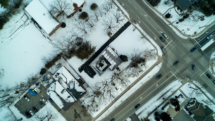 Looking down on an intersection from a high angle view during the winter in a subdivision