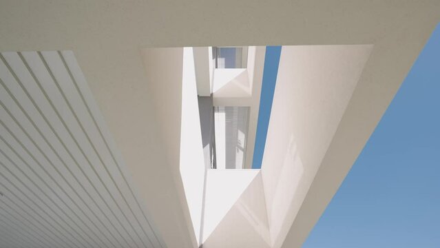 Modern architecture geometrical shapes white surface, sky