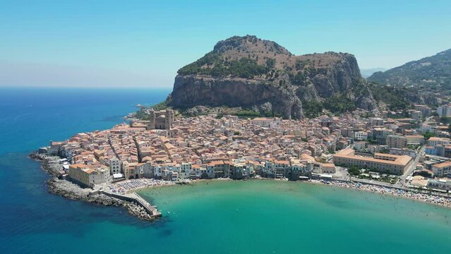 Cefalu City, Beach and Rock during Summer in Sicily, Italy - Aerial 4k