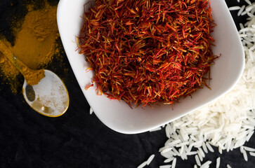 Top View Macro Image of Fresh Saffron and Turmeric with White Rice