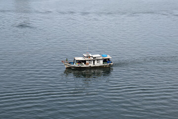 ships boats fishing trollers on ocean sea water of south China sea bay kota Kinabalu sabah