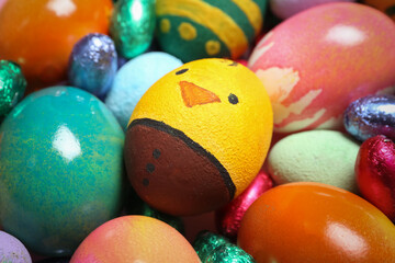 Fototapeta na wymiar Colorful Easter eggs and candies, closeup