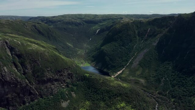 Gros Morne National Park, Newfoundland, Canada - Push In Drone Shot of the mountains with lake below