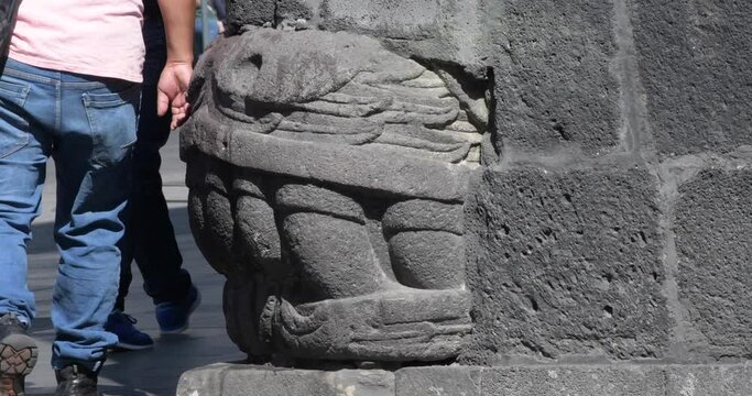 Remains of Aztec civilization in Spanish buildings in streets of downtown Mexico