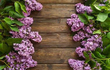 Blooming lilac flowers lie on a wooden background. Space for text. Mockup.  