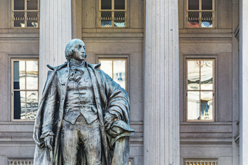 Albert Gallatin statue in front of the US Treasury Building in downtown Washington, DC - 567239927