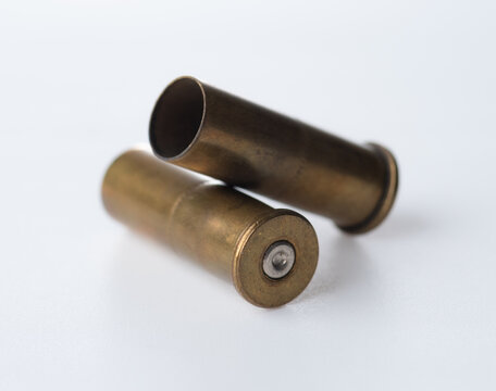 Brass bullet shells, 38 size for revolver handgun on white background
