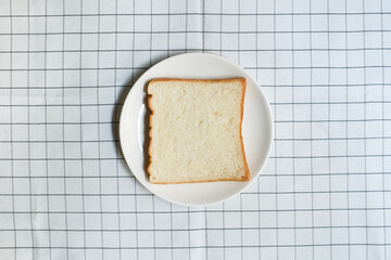 Sliced bread in a white plate, Homemade bread for breakfast in the morning.