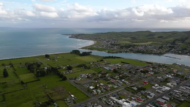 Small coastal town of Riverton in New Zealand, high altitude drone view