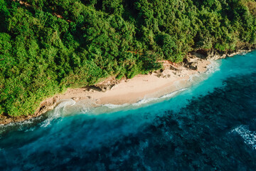 Tropical beach with ocean in Bali. Aerial view of Green bowl beach