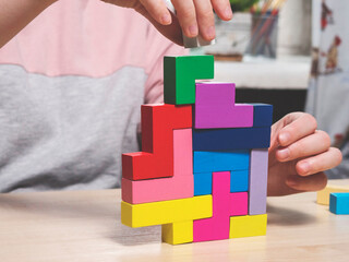 Board game, a tower of geometric shapes. Developmental board games.