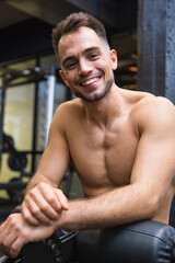 Fototapeta na wymiar bare chested young man in the gym