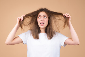 Fototapeta premium Woman with hair loss problem worried about hair loss.