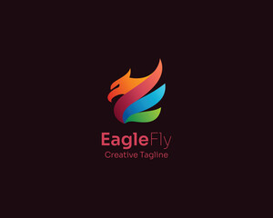 Fototapeta premium Flying eagle with colorful wings logo gradient