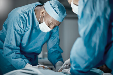Surgery, hospital and healthcare doctors in operating room for emergency operation on patient....