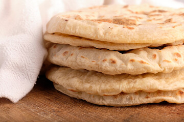 pita bread on wooden board
