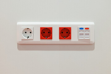 Block of electrical sockets with a European type of connector and rj45 sockets for the Internet and telephone.