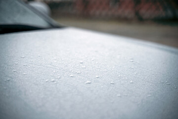 Frozen car on the outside parking. Transport in winter. Vehicle close-up with frozen windshield and windows.