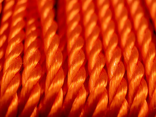 Orange rope close-up. Texture of braided rope.