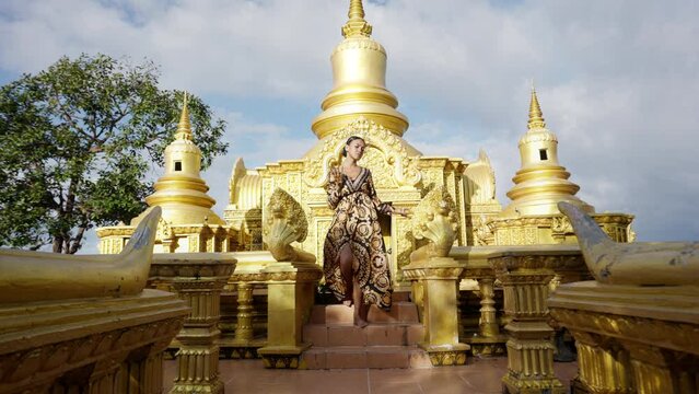 Woman Dancing By Golden Khmer Temple