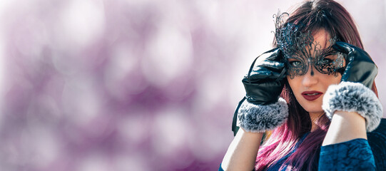 elegant woman with party or carnival mask and copy space