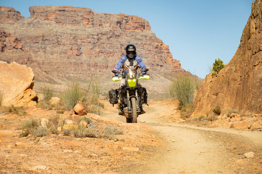 Person riding a bike on a mountain pass