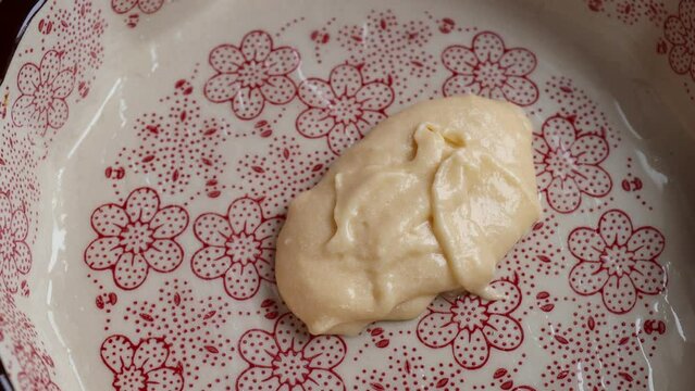 Put the dough into a baking dish. Stages of preparation of cuca de banana. Silicone spatula to spread the dough