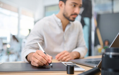 Graphic tablet pen, laptop and photographer editing camera photoshoot, focus on digital art or retouching artistic photo. Photography vision, drawing tool and creative man working on design process