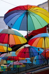 colorful umbrellas hang in the air