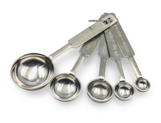 Close up Metal measuring spoons isolated on white background, kitchenware concept.