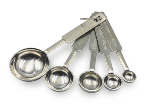 Close up Metal measuring spoons isolated on white background, kitchenware concept.