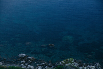 Fototapeta na wymiar rocky seashore, surface and blue, texture, Italy, Sicily