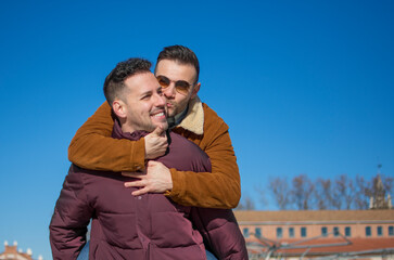 A portrait of happy gay couple outdoors 