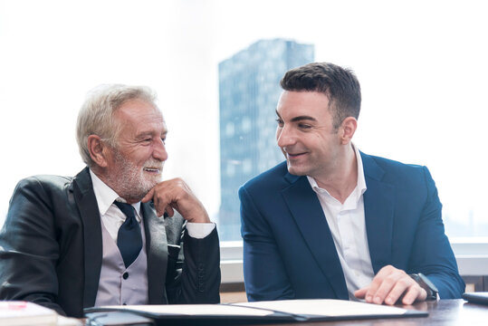 businessman talking and explane business deal  at skyscraper office lounge with cityscape business zone background