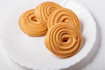 A stack of sweet cookies on a white background.