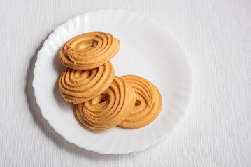 A stack of sweet cookies on a white background.