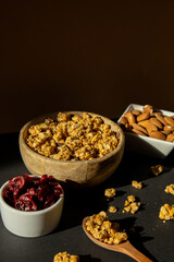 Homemade granola with nuts and seed. Healthy snack on breakfast. Muesli from oatmeal, raisins, honey, cranberry, flax, almond, cashew, freshly baked